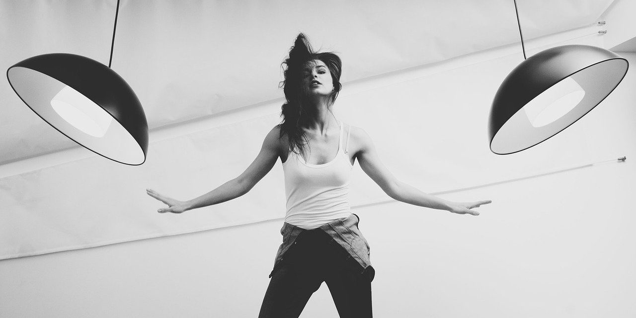 Interior of photography studio with lights and various equipment and props.