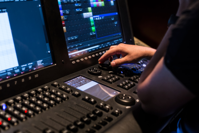 A person on a computer Description automatically generated