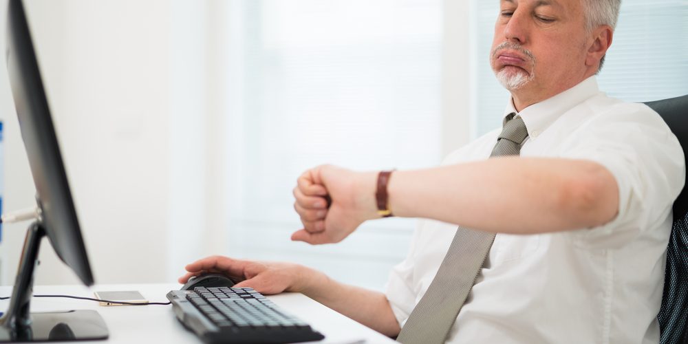 A person sitting at a desk Description automatically generated