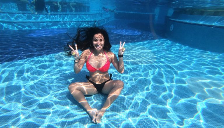 Woman Wearing Red and Black Bikini Under Pool