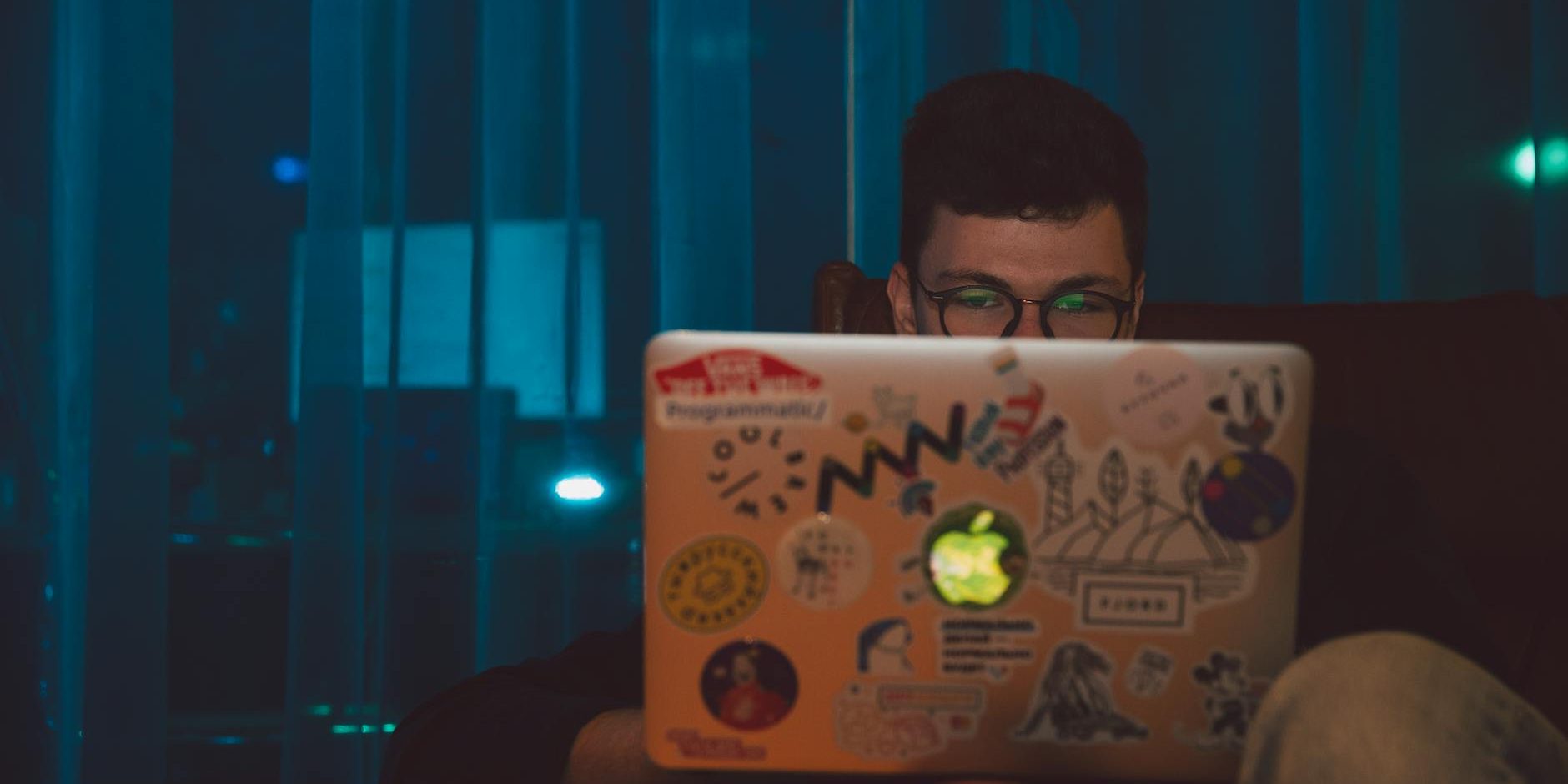 photo of man using laptop