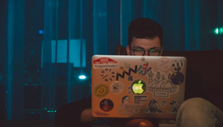 photo of man using laptop