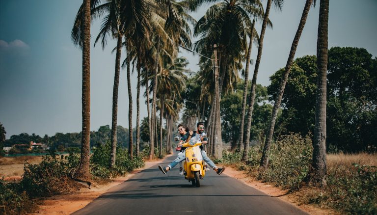 woman and man riding on motorcycle