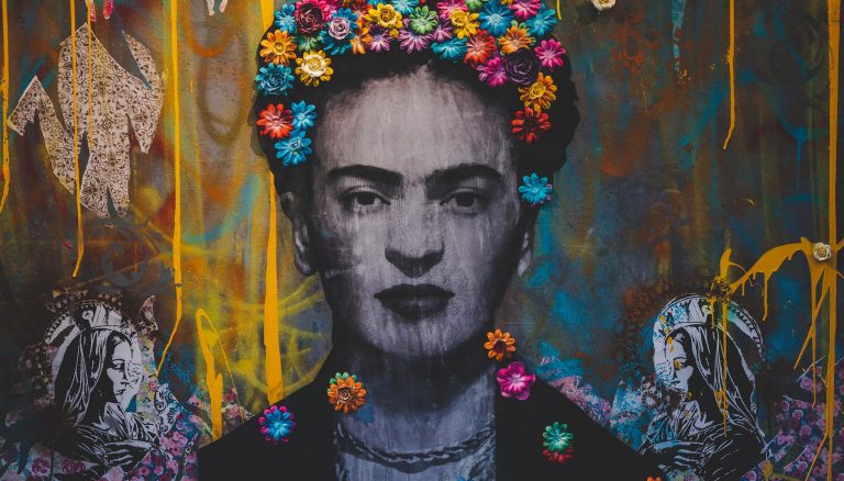 creative graffiti wall with portrait of frida kahlo