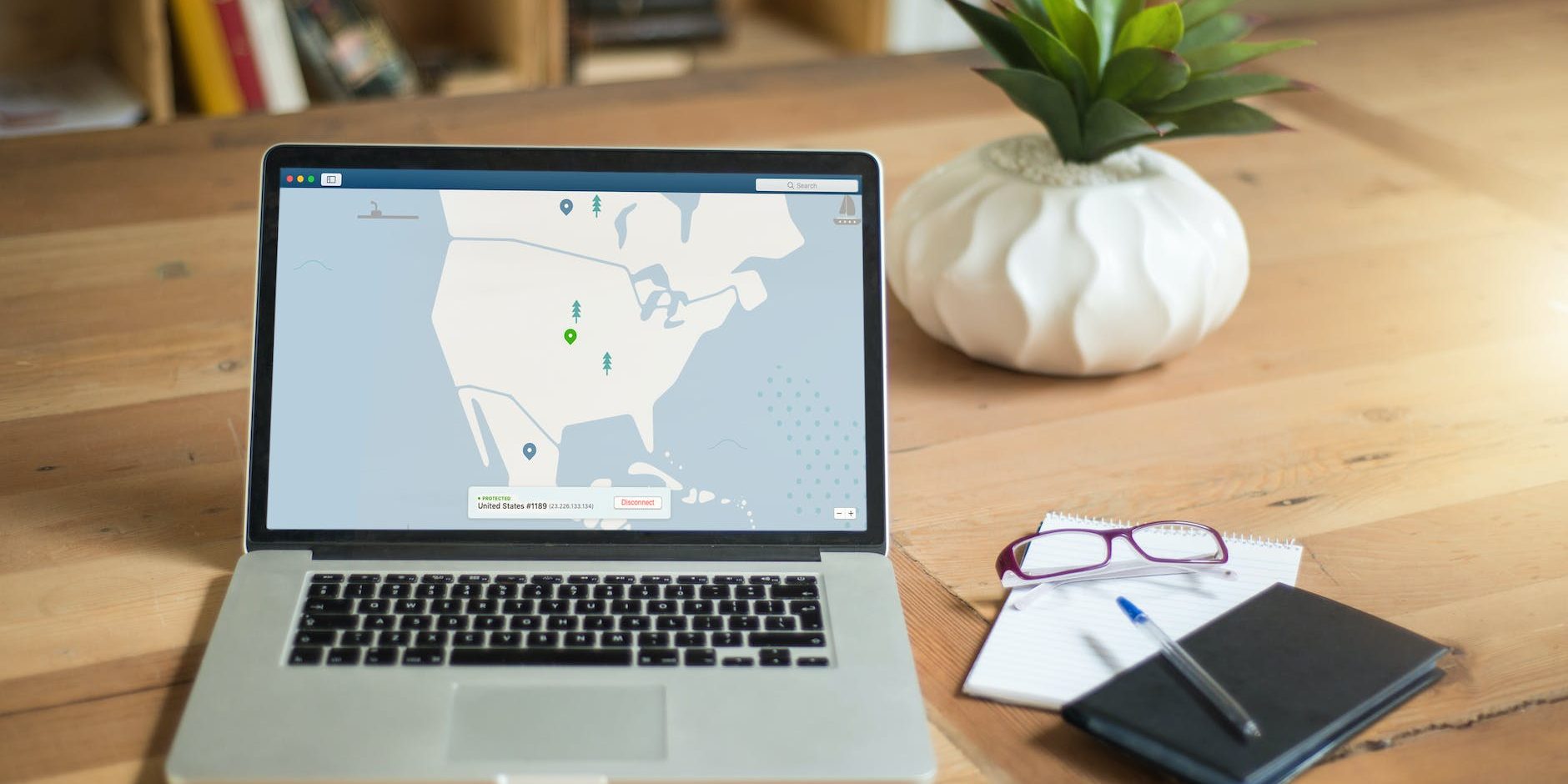macbook pro on brown wooden table