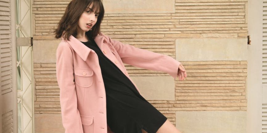 woman wearing pink overcoat and black inner top
