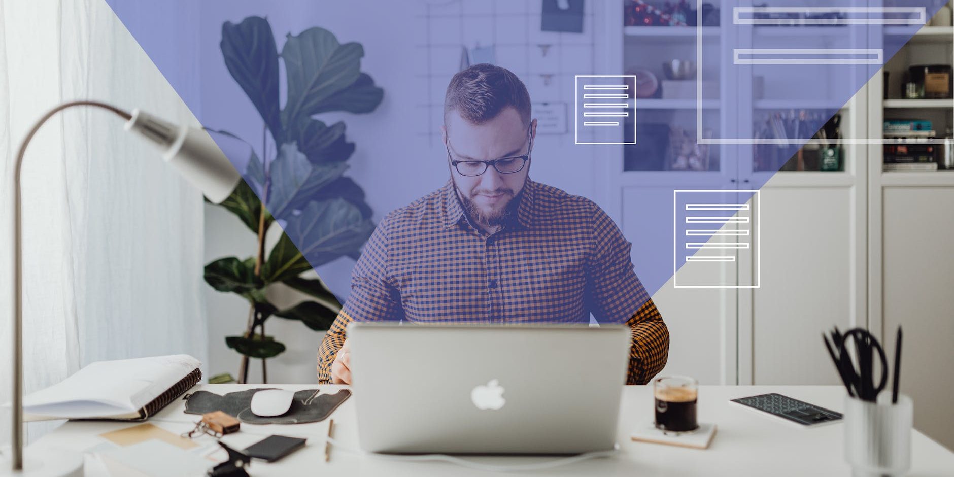 man in blue and white checkered dress shirt using silver macbook