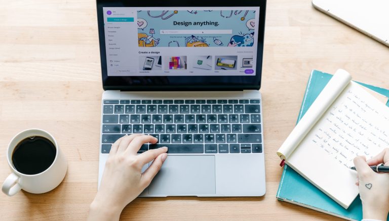 crop person making notes in notepad