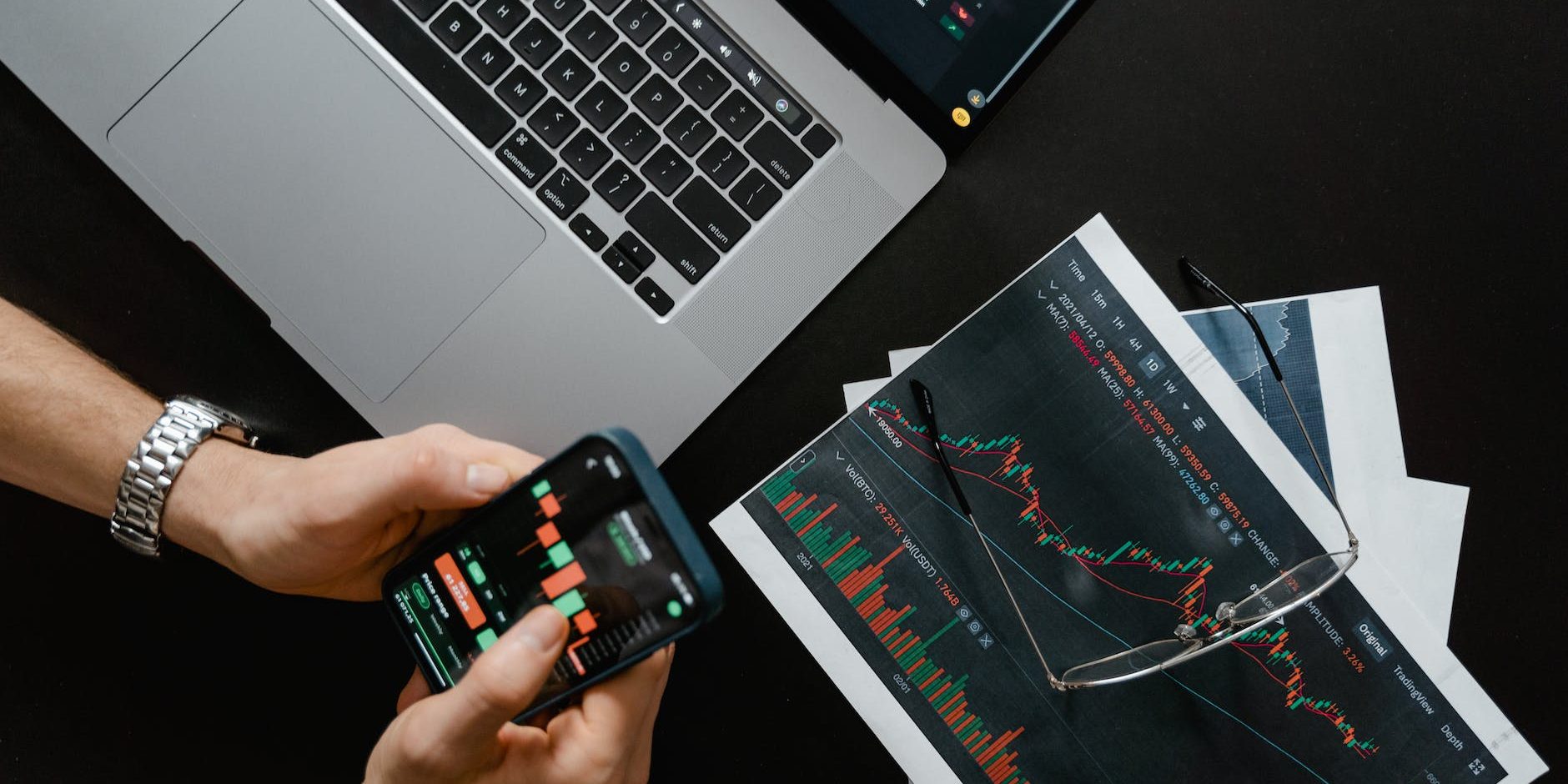 hands holding a smartphone with data on screen