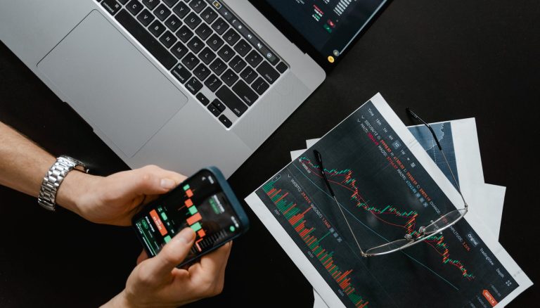 hands holding a smartphone with data on screen