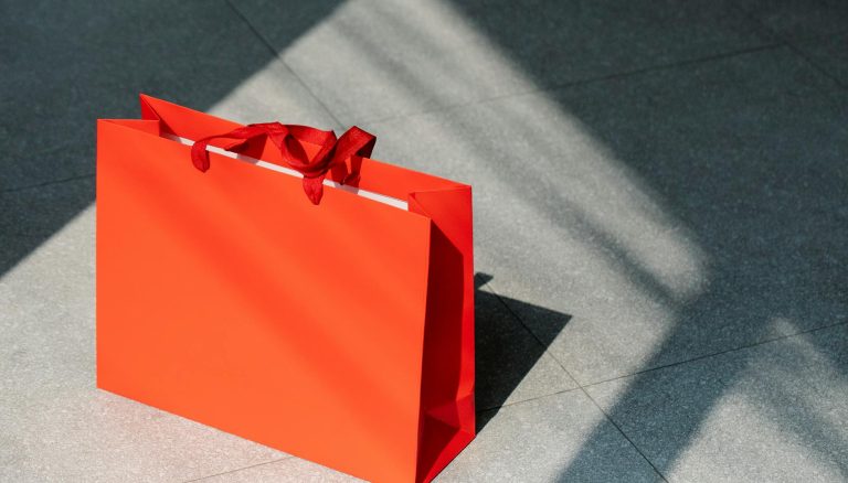 red paper shopping bag on gray ground