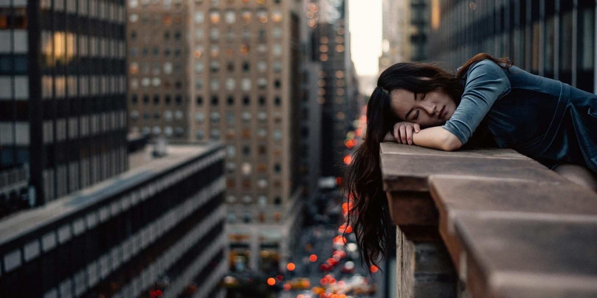 a person leaning on a ledge
