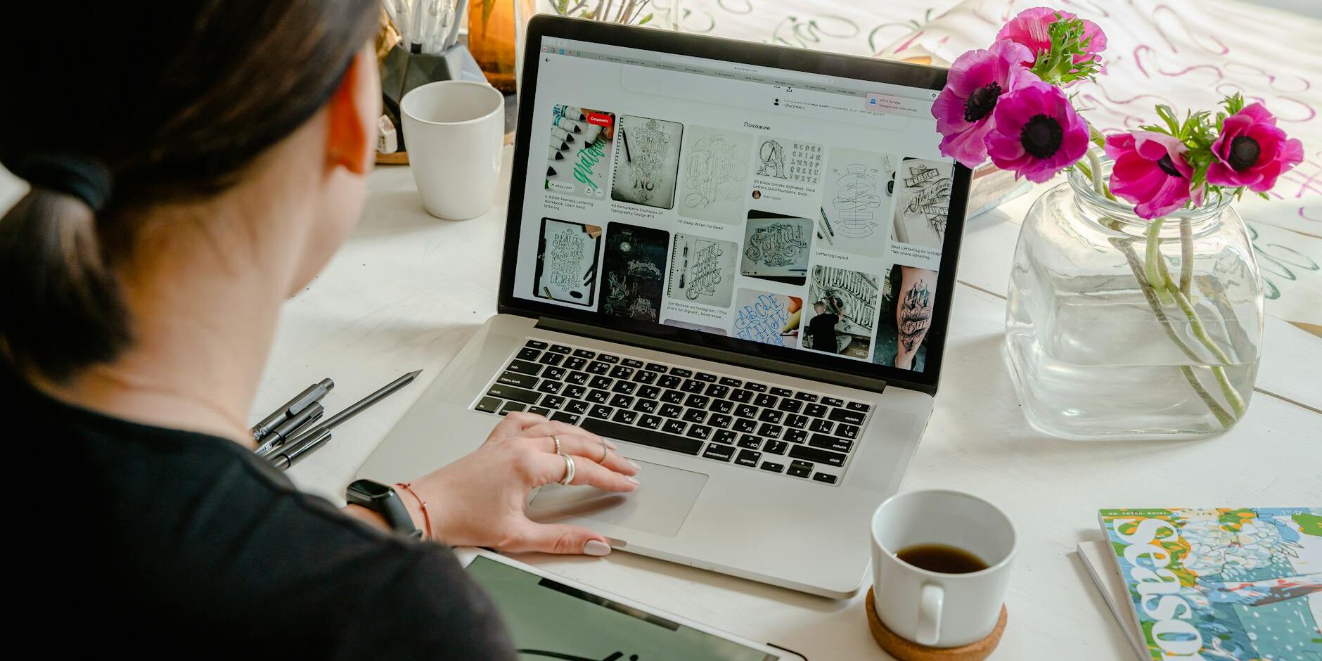 photo of person using laptop for graphic designs