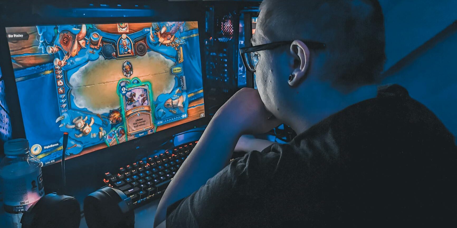 overweight man playing video game at night