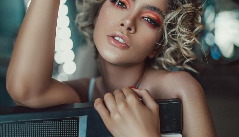 stylish young female artist with synthesizer in dressing room