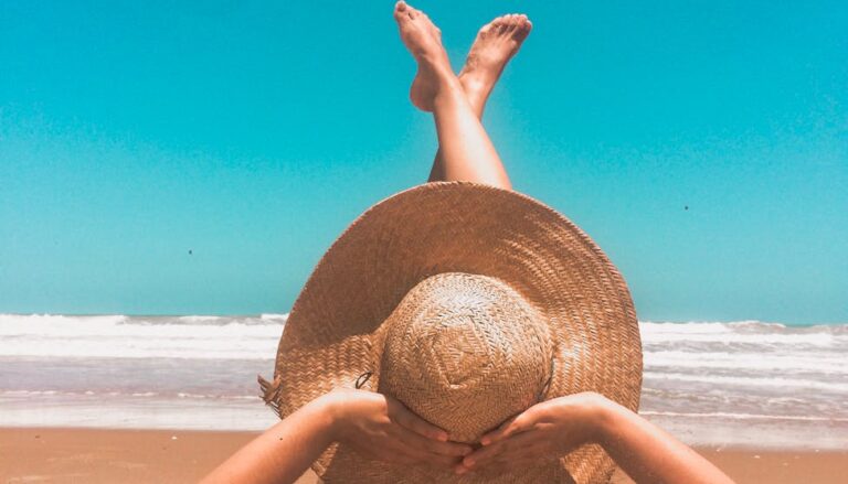 person laying on sand