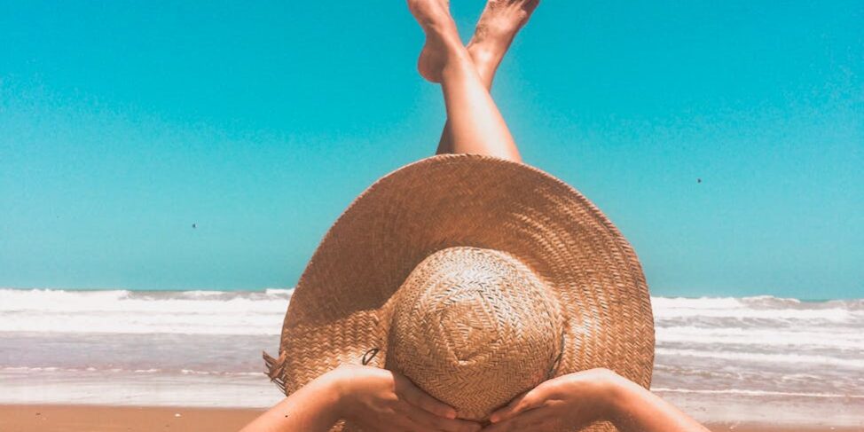 person laying on sand
