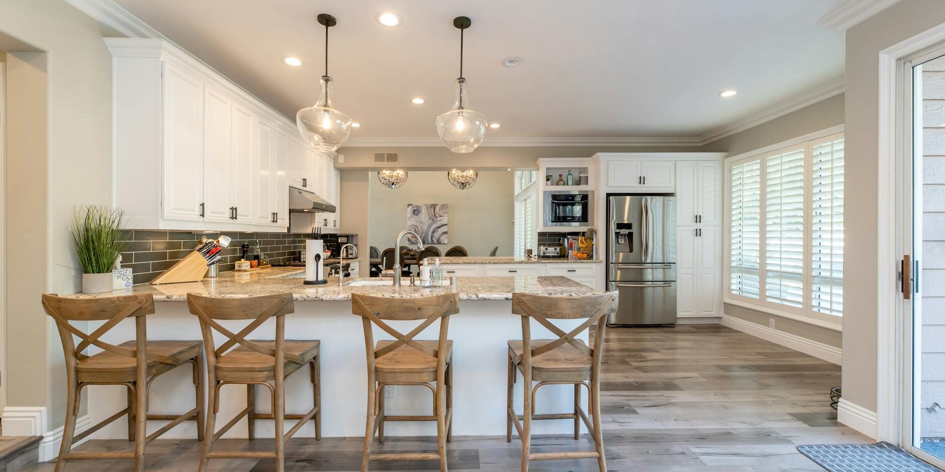 four brown wooden chairs