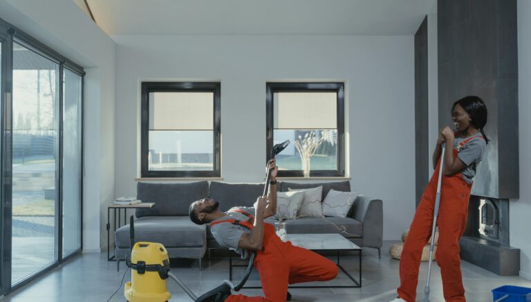 man and woman in orange overalls having fun while doing work