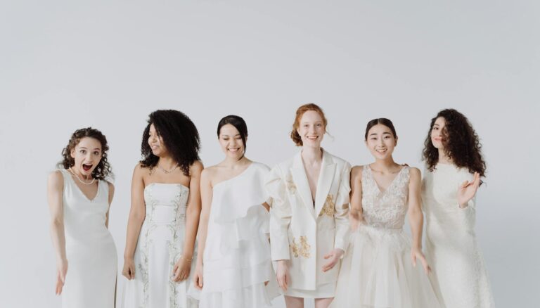a group of happy women in white dress