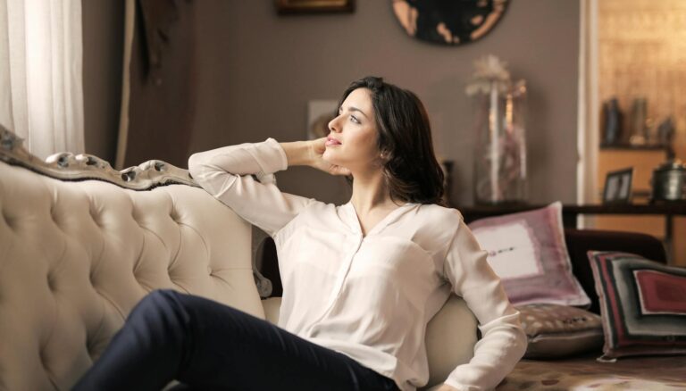 woman in white dress shirt and black pants