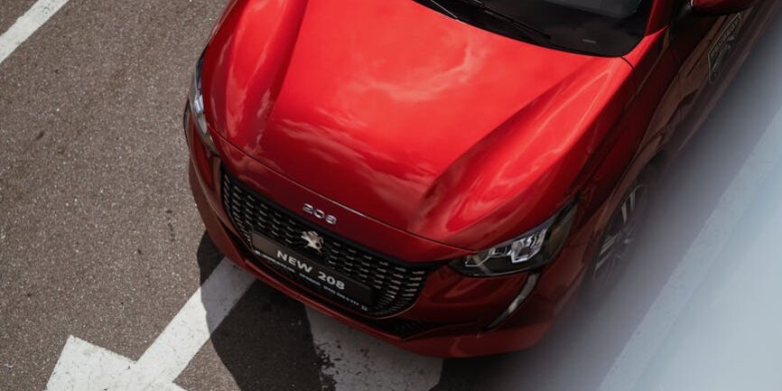 red car on a street