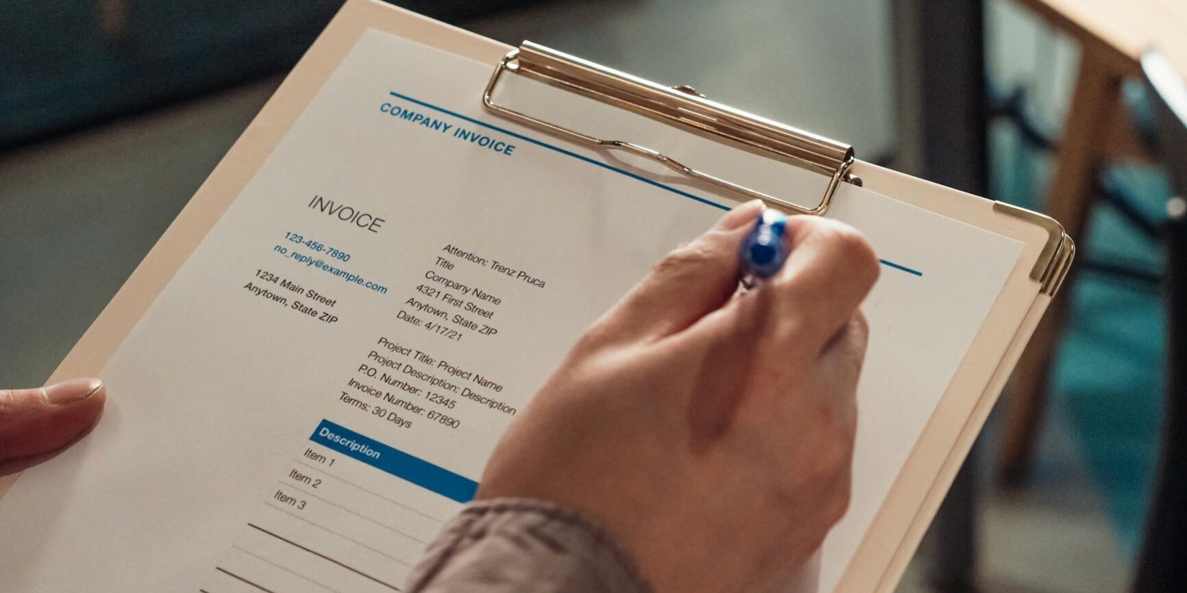 close up shot of a person holding a clipboard