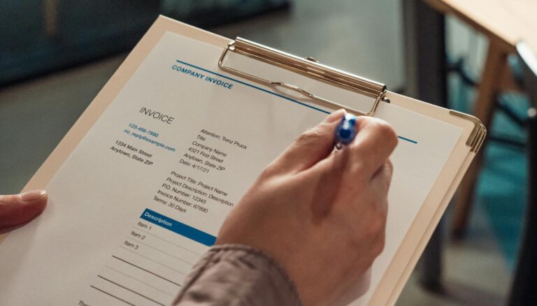 close up shot of a person holding a clipboard