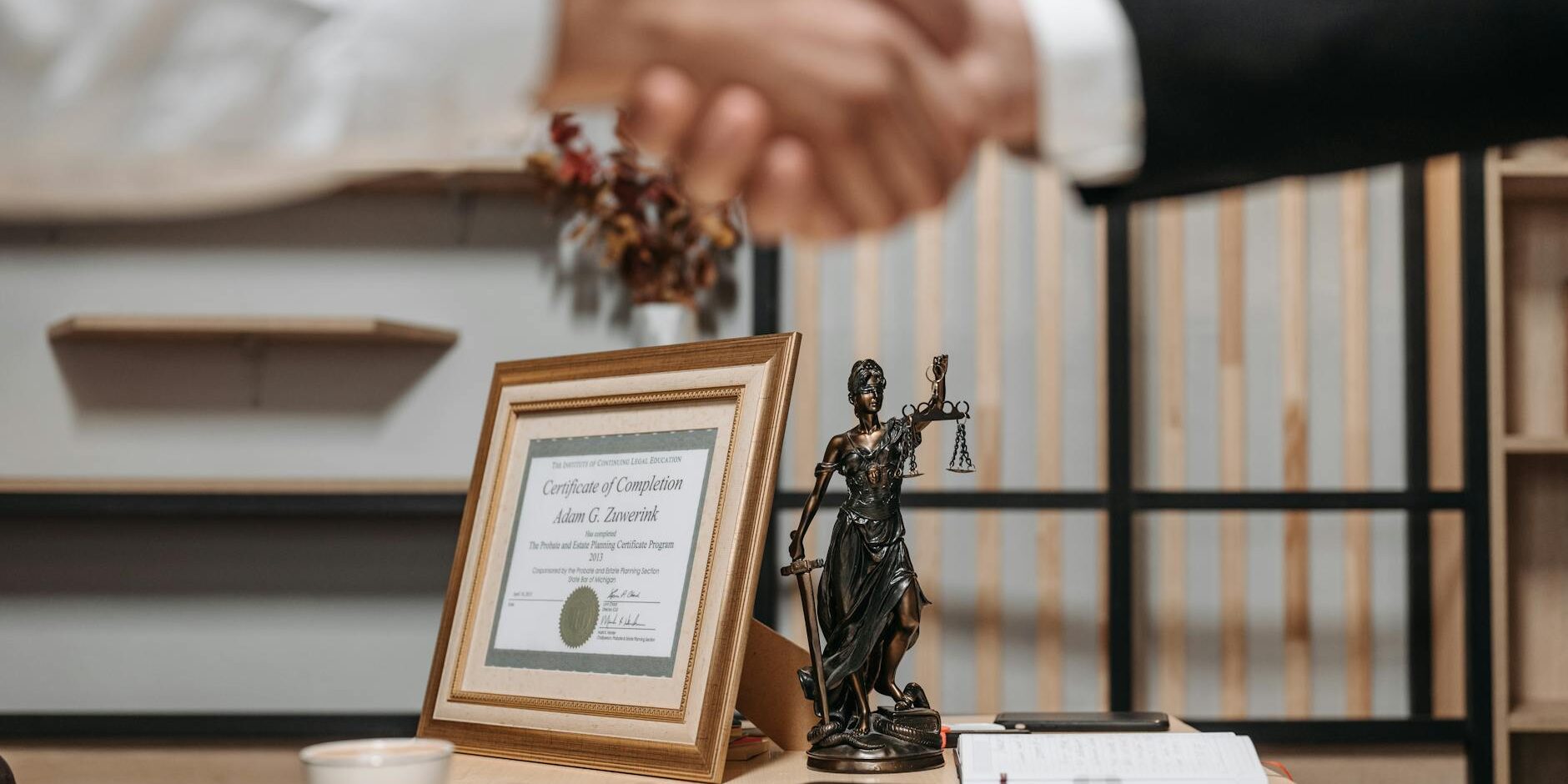 people shaking hands at lawyers office