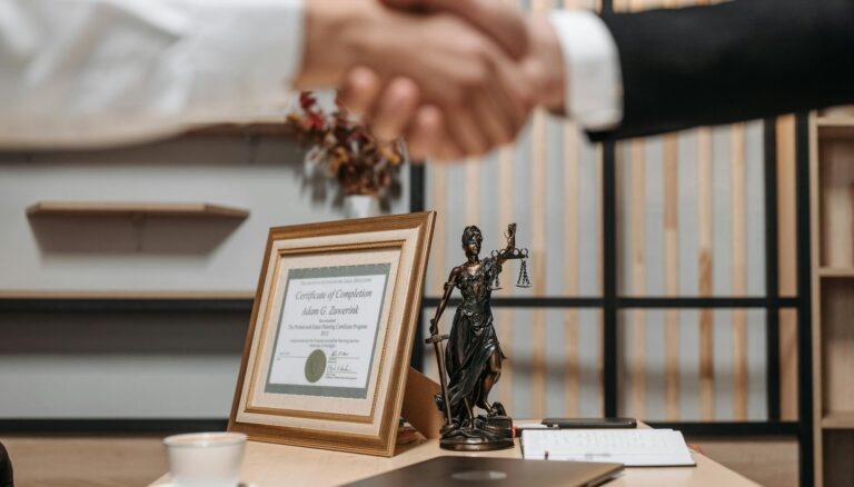 people shaking hands at lawyers office