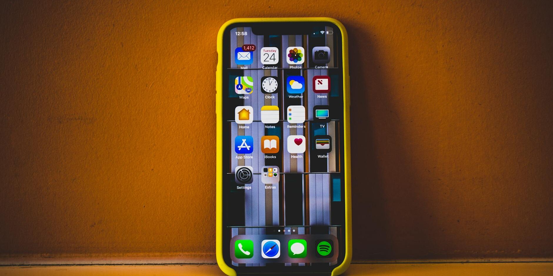 turned on iphone x with yellow case