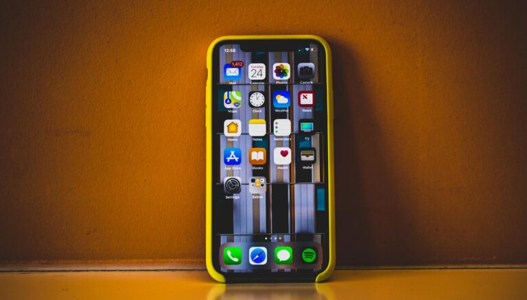 turned on iphone x with yellow case