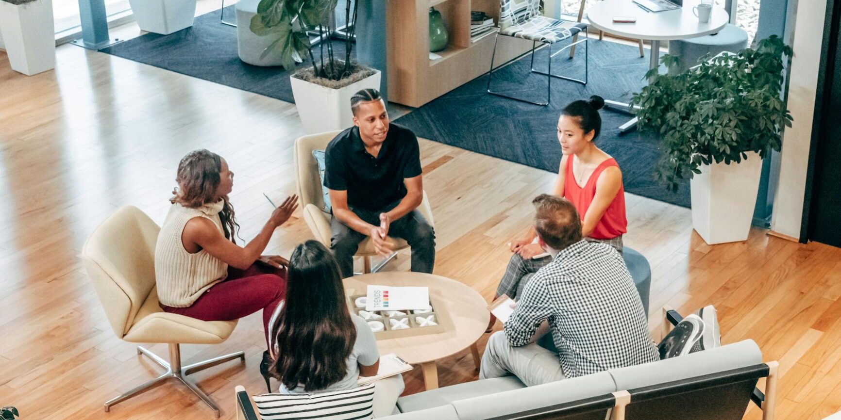 people sitting on chair in front of table
