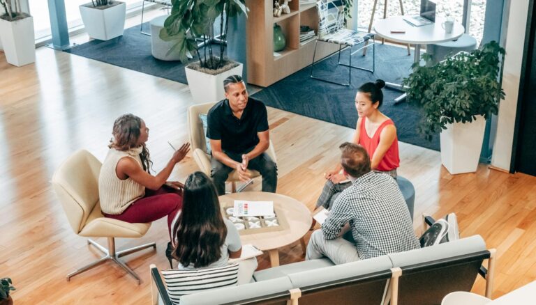 people sitting on chair in front of table