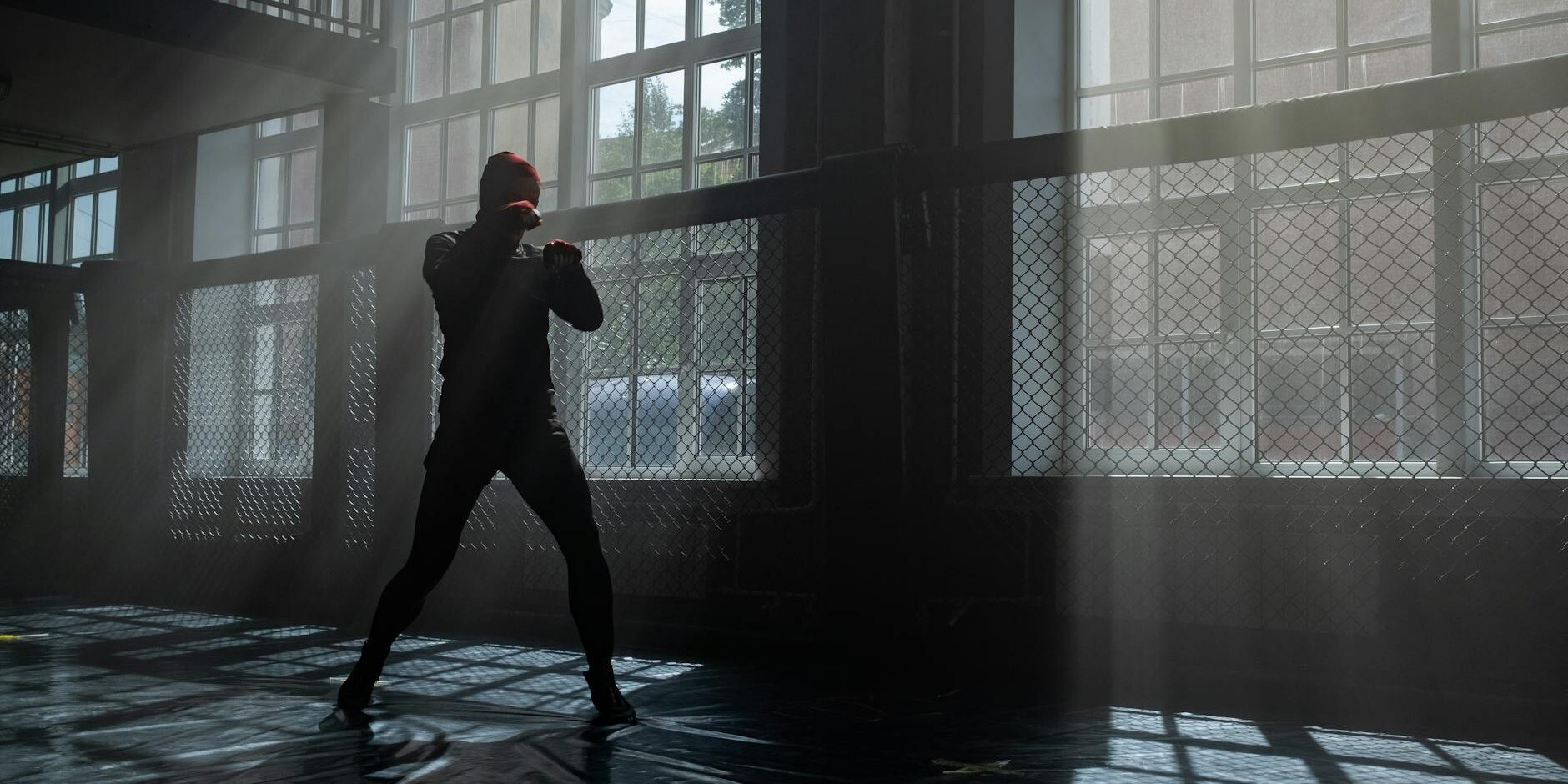 silhouette of person doing shadow boxing