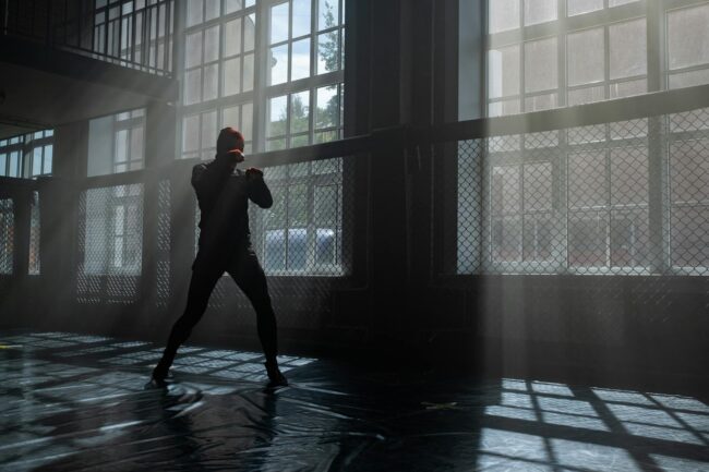 silhouette of person doing shadow boxing