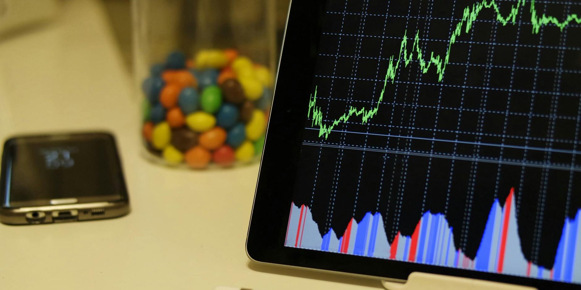 white android tablet turned on displaying a graph