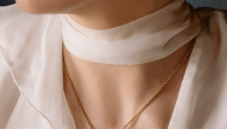 woman wearing gold necklace