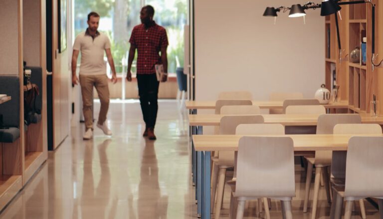 man in black t shirt standing near woman in white t shirt