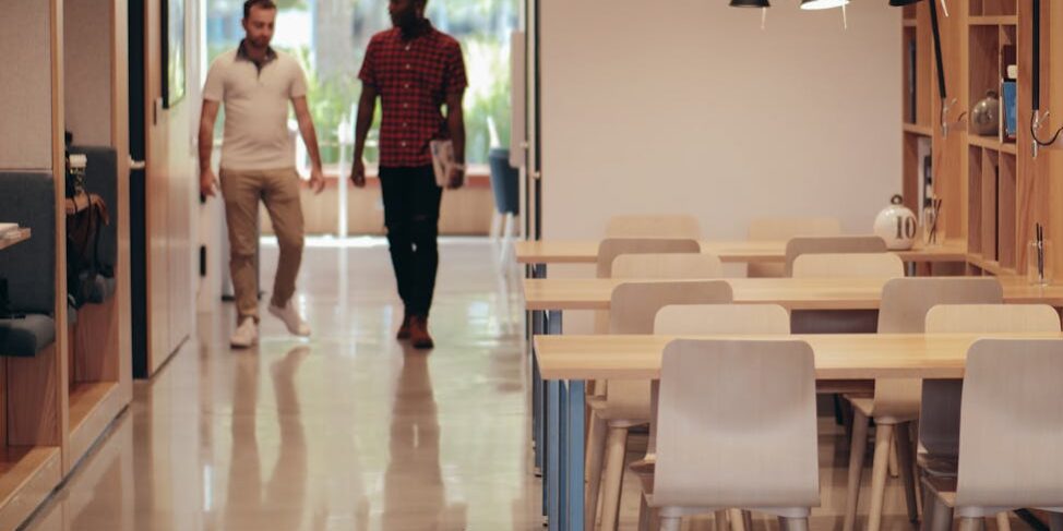 man in black t shirt standing near woman in white t shirt