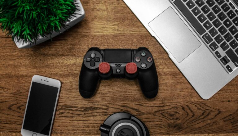 black game console on wooden surface