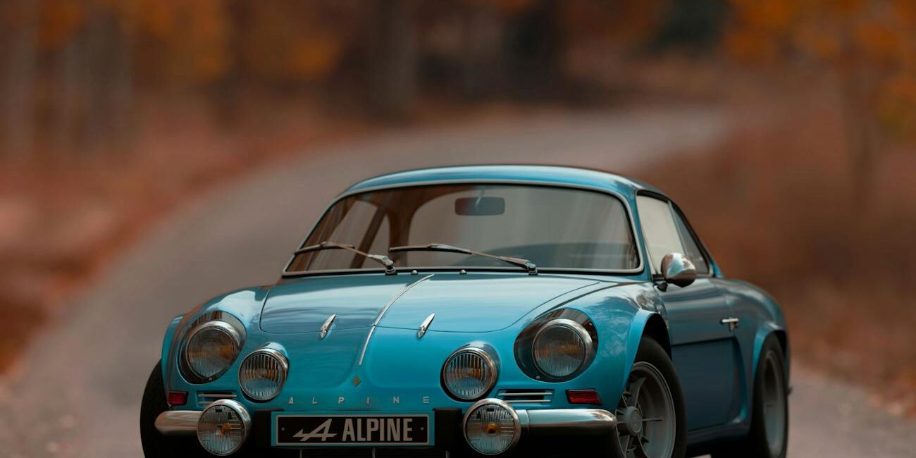 shallow focus photography of blue alpine car