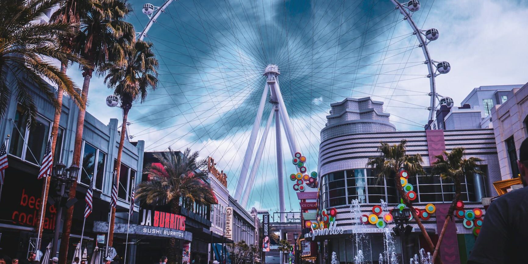 people walking on amusement park near buildings