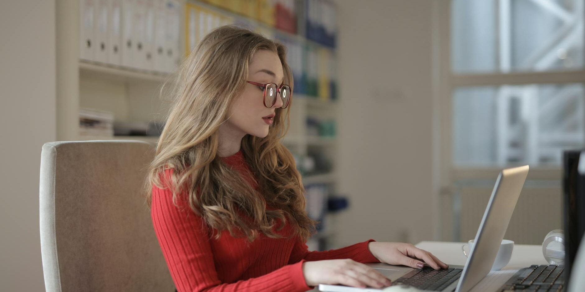 focused woman working using laptop