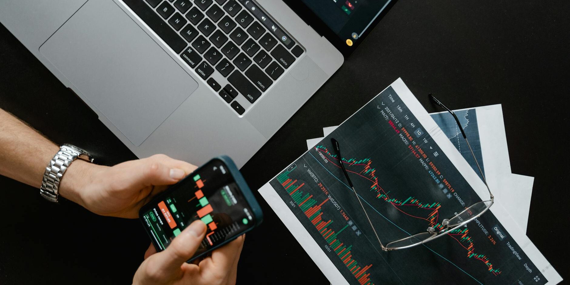 hands holding a smartphone with data on screen