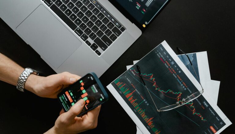 hands holding a smartphone with data on screen