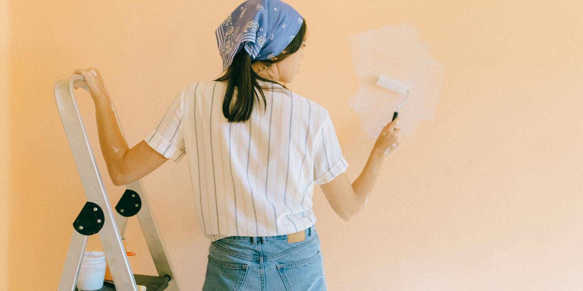woman painting a wall