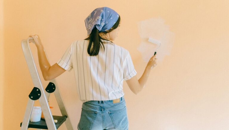 woman painting a wall