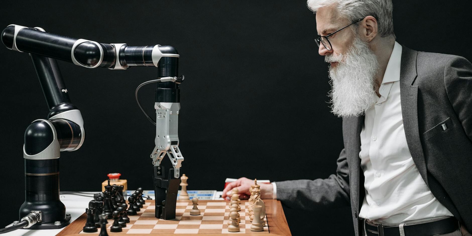 a bearded man playing chess