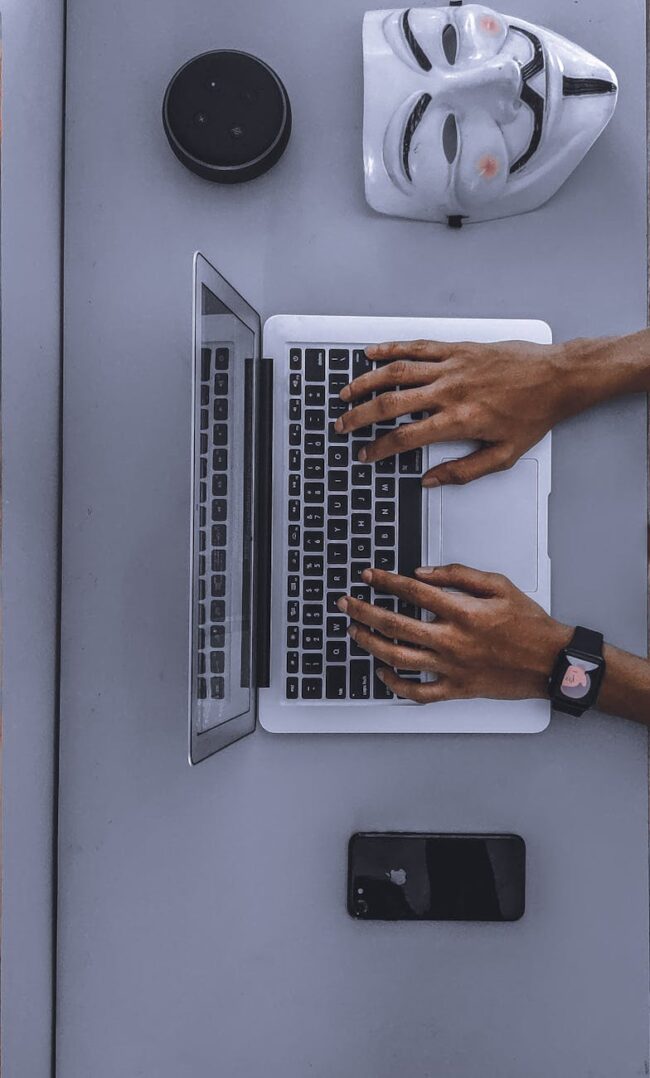 person using laptop on gray table